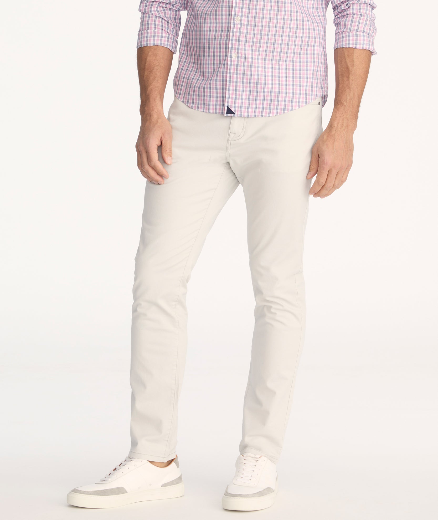 Model is wearing UNTUCKit 5-Pocket Chino Pants in light gray.