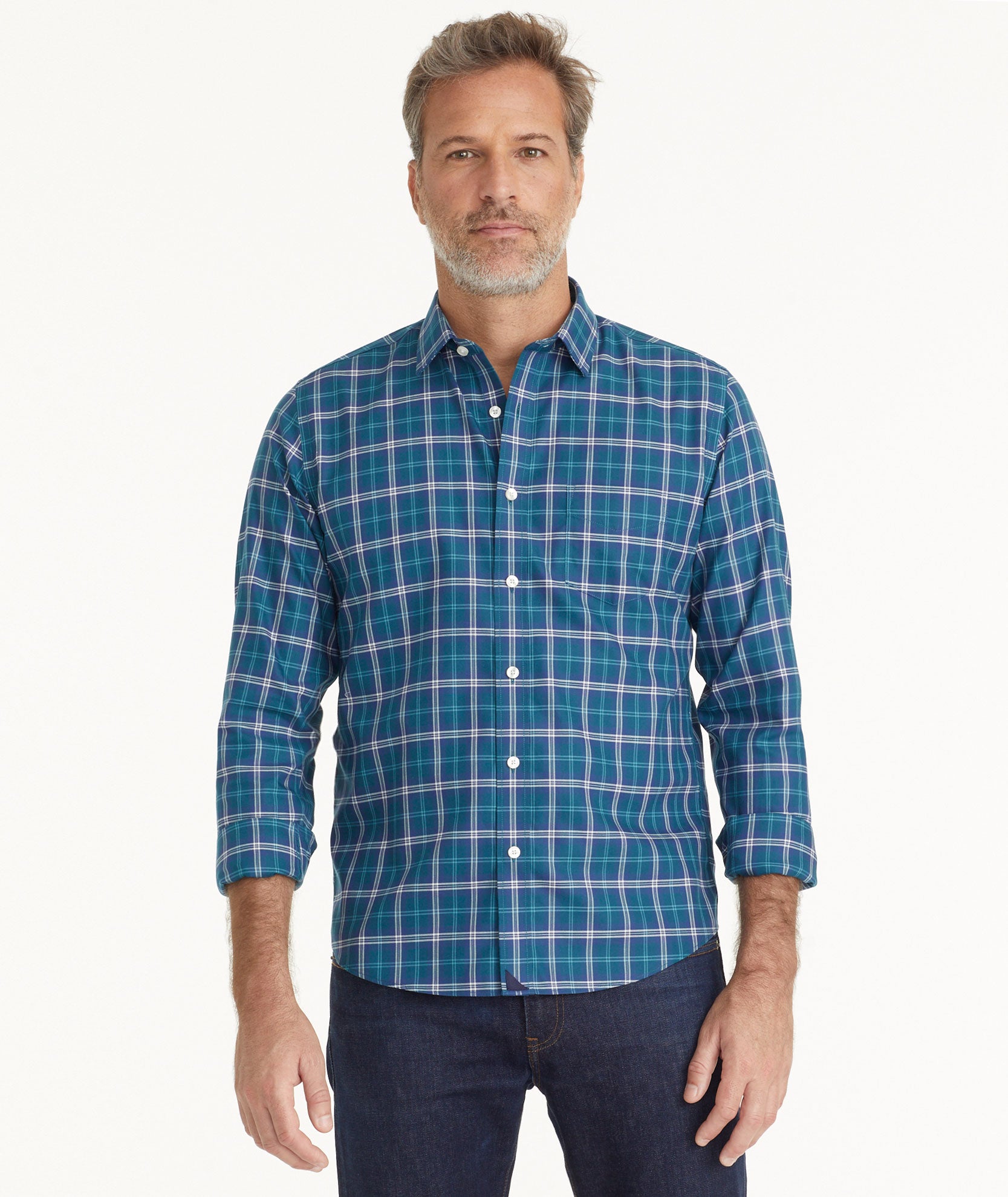 Model is wearing UNTUCKit Wrinkle-Free Harwin Shirt Teal Multi Plaid.