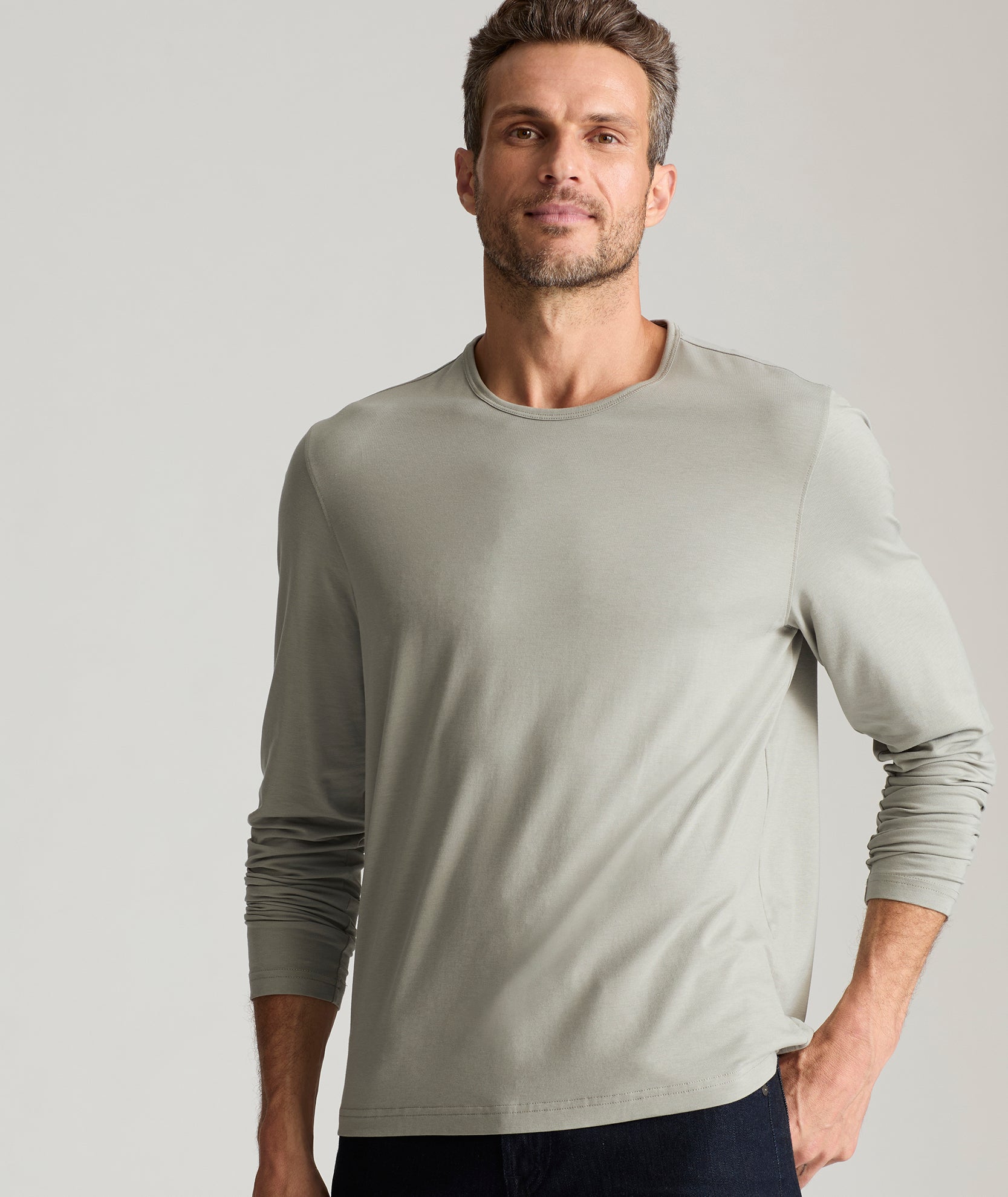 Model is wearing UNTUCKIt Merille long sleeve Tencel Tee in Military Green.