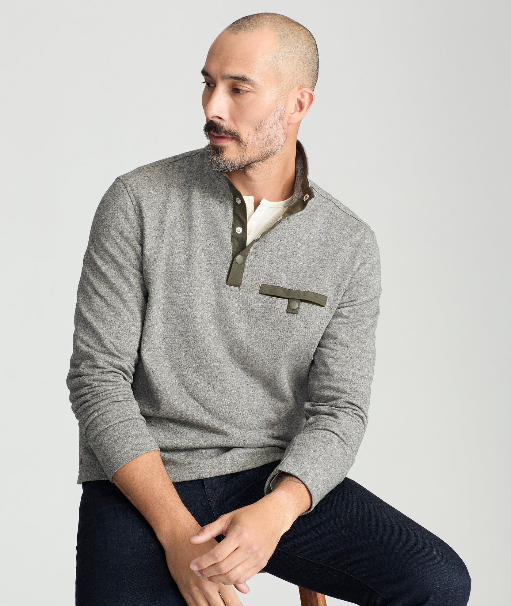 Model is wearing UNTUCKit Parkson quarter-zip sweatshirt in fog. 