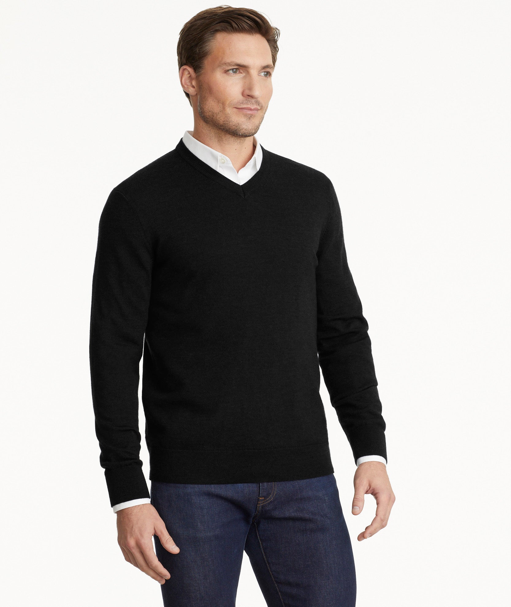 Model is wearing UNTUCKit sweater in black.