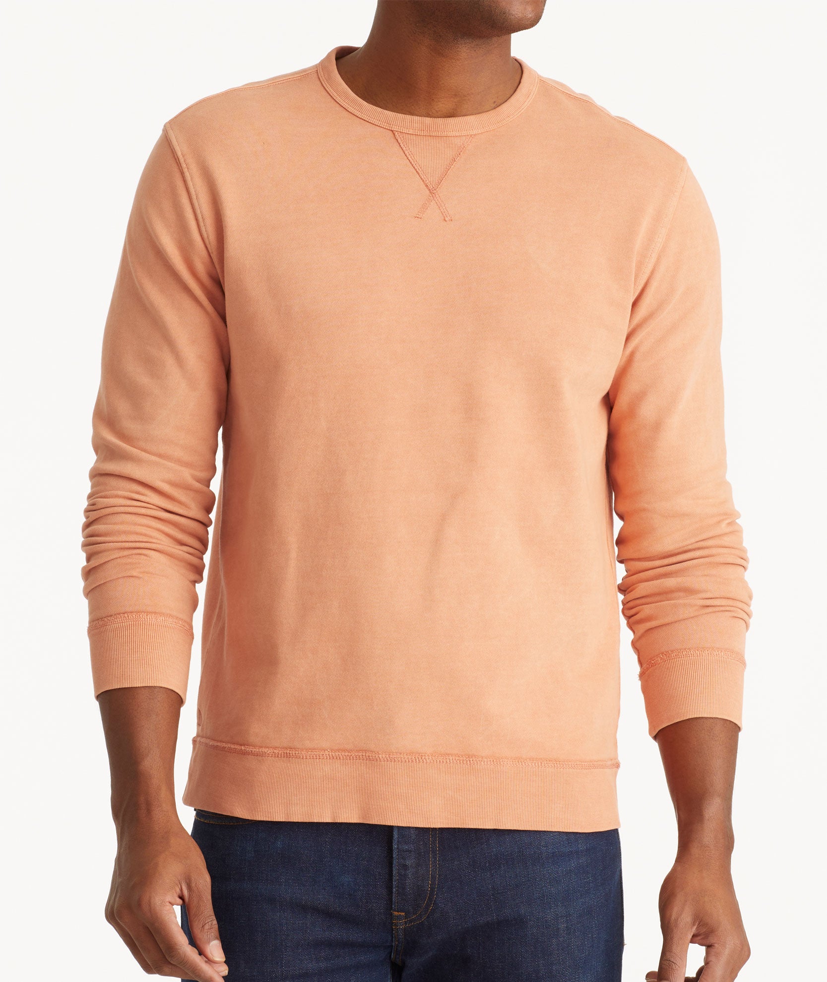 Model wearing an UNTUCKit Orange Mineral Dye Sweatshirt