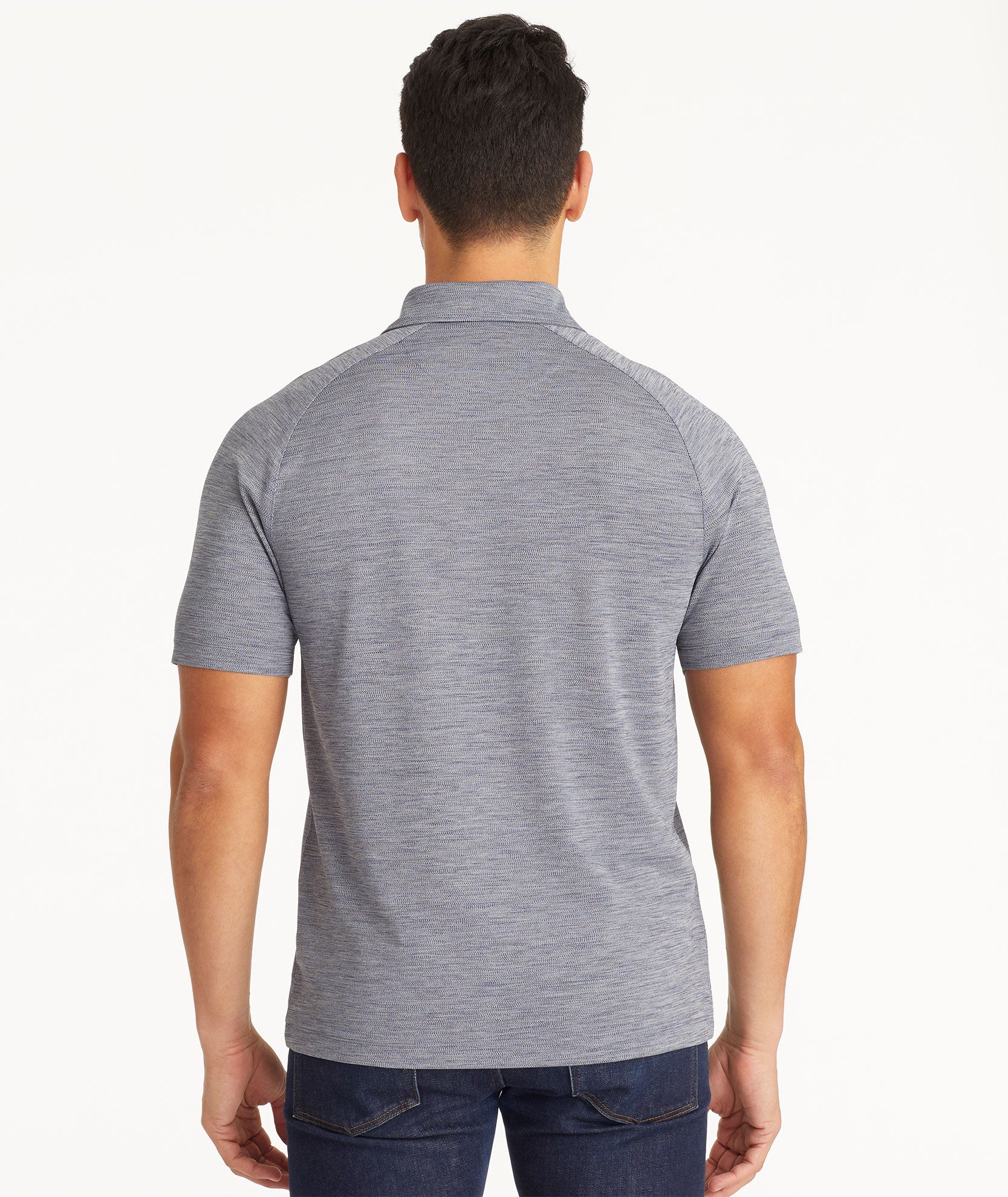 Model wearing an UNTUCKit Dark Blue No Sweat Heathered Polo